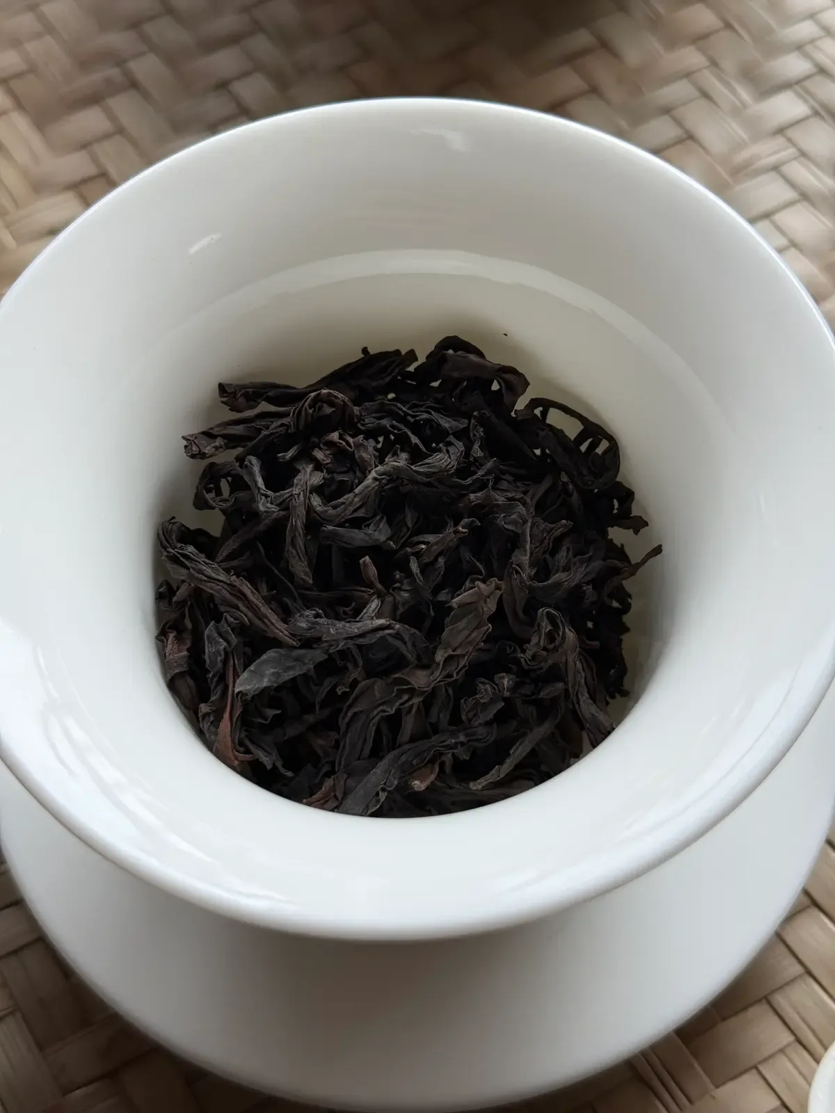 Competition-grade Da Hong Pao dry leaf — tight, uniform, darkly roasted
